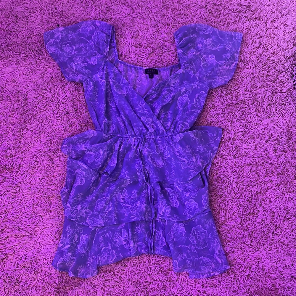 It’s blue with white flowers. Size small for a teen/kid. Never worn